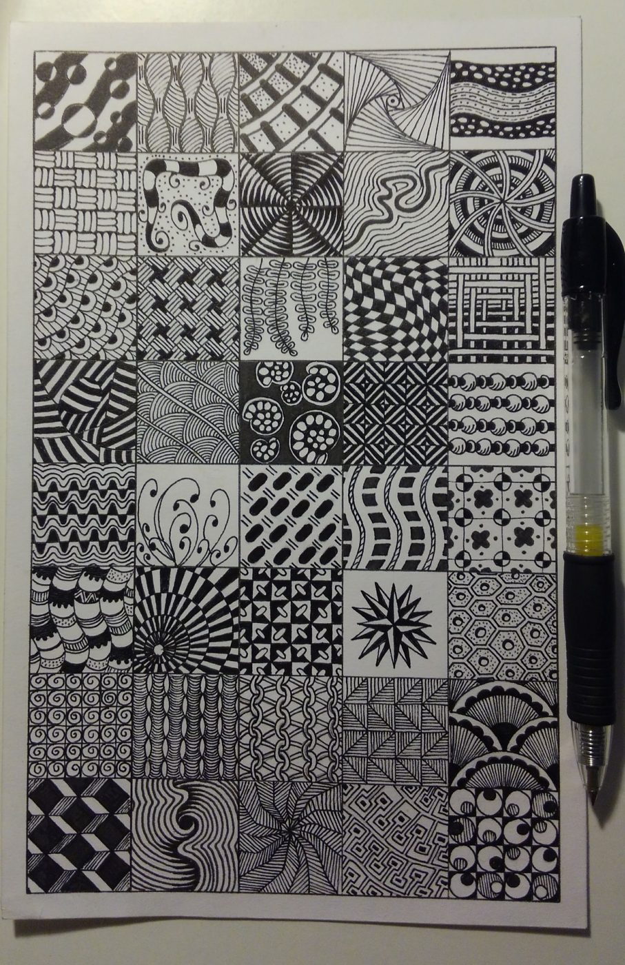 Ink pattern sampler: a grid of 40 different hand-drawn patterns beside a pen